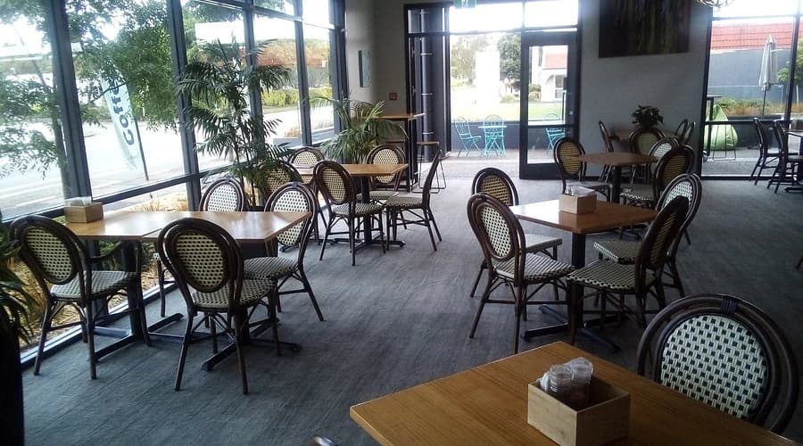 Cafe interior before enhancement, flat light and a grey looking floor